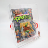GENERAL TRAAG - 1989 PLAYMATES - AFA GRADED 70+ EX+ NEW Authentic & Factory Sealed! (Vintage TMNT Figure)