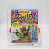WACKY ACTION BREAKFIGHTIN' RAPHAEL - 1989 PLAYMATES - AFA GRADED 80 NEW Authentic & Factory Sealed! (Vintage TMNT Figure)