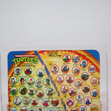 APRIL O'NEIL (ORANGE/BLUE STRIPES) - 1993 PLAYMATES - CAS GRADED 80 NEW Authentic & Factory Sealed! (Vintage TMNT Figure)